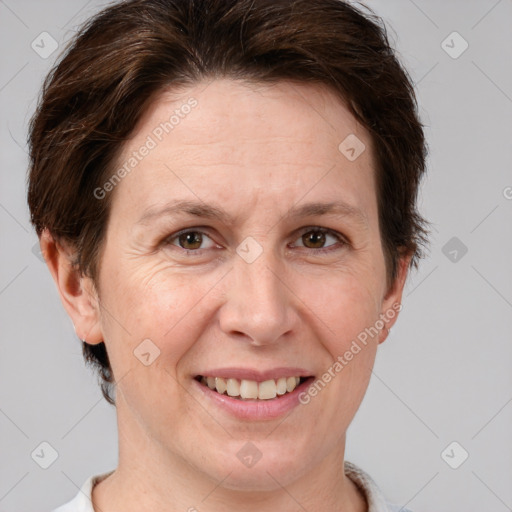 Joyful white adult female with short  brown hair and brown eyes