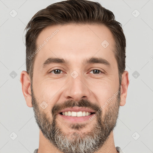 Joyful white adult male with short  brown hair and brown eyes