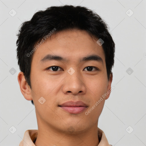 Joyful asian young-adult male with short  black hair and brown eyes