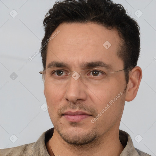 Joyful white adult male with short  brown hair and brown eyes