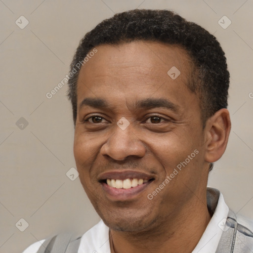 Joyful latino adult male with short  black hair and brown eyes