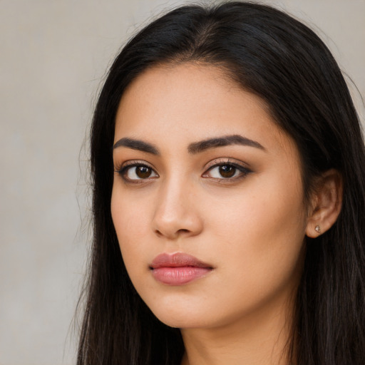 Neutral latino young-adult female with long  black hair and brown eyes
