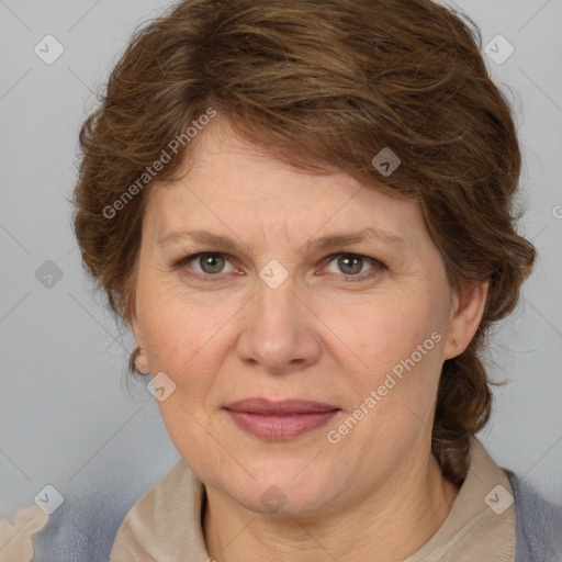 Joyful white adult female with medium  brown hair and blue eyes