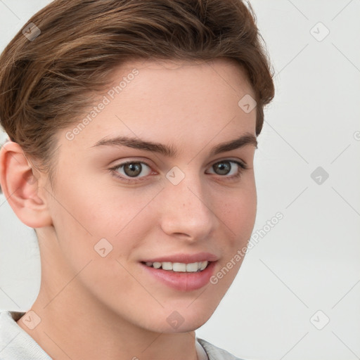 Joyful white young-adult female with short  brown hair and grey eyes