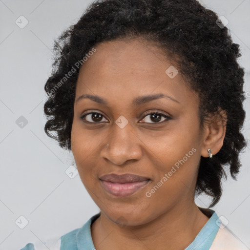 Joyful black adult female with short  brown hair and brown eyes