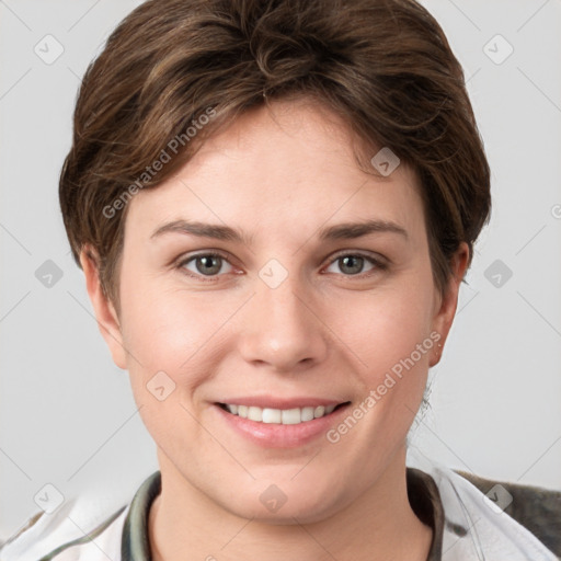 Joyful white young-adult female with short  brown hair and grey eyes