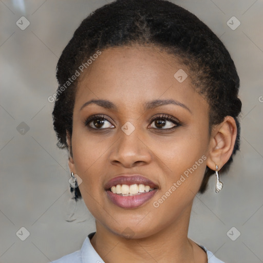 Joyful black young-adult female with short  brown hair and brown eyes