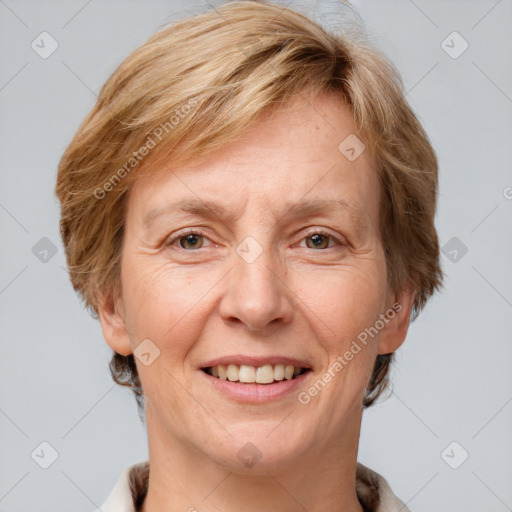 Joyful white adult female with short  brown hair and grey eyes