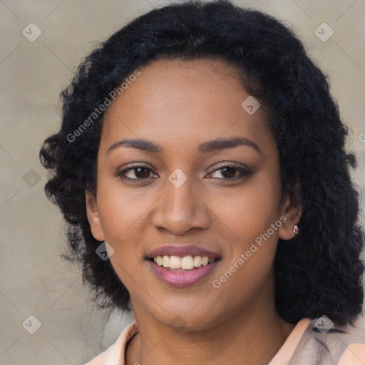 Joyful black young-adult female with long  black hair and brown eyes