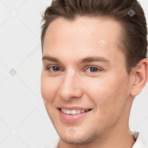 Joyful white young-adult male with short  brown hair and brown eyes