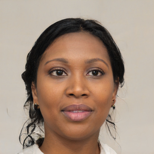 Joyful black young-adult female with medium  black hair and brown eyes