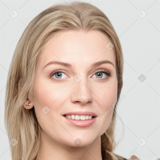 Joyful white young-adult female with long  brown hair and blue eyes