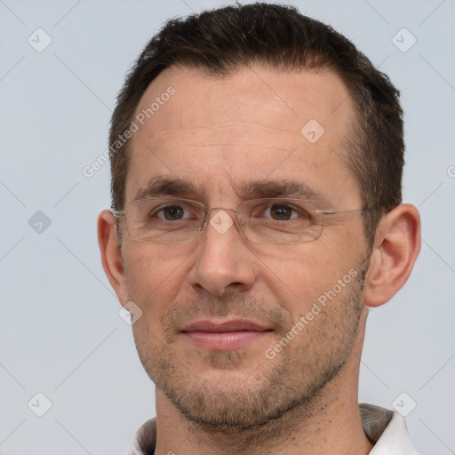 Joyful white adult male with short  brown hair and brown eyes