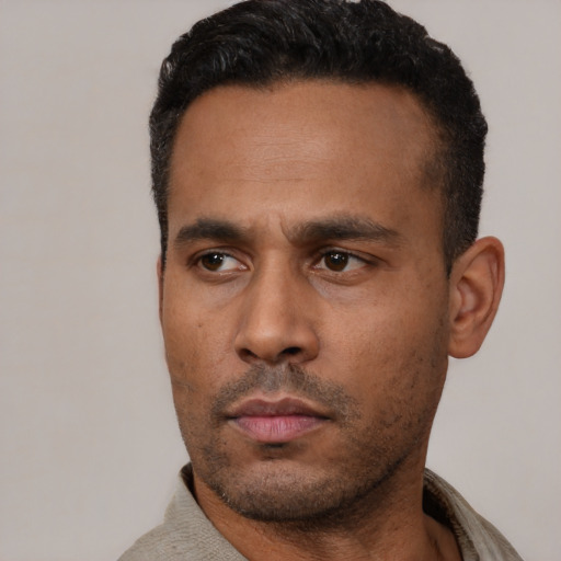 Neutral latino young-adult male with short  black hair and brown eyes