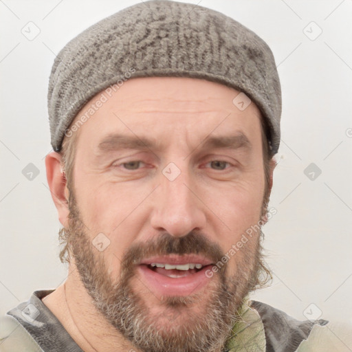 Joyful white adult male with short  brown hair and grey eyes