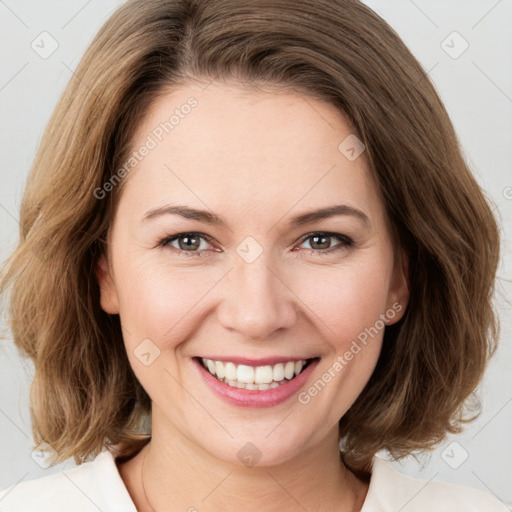 Joyful white young-adult female with medium  brown hair and green eyes