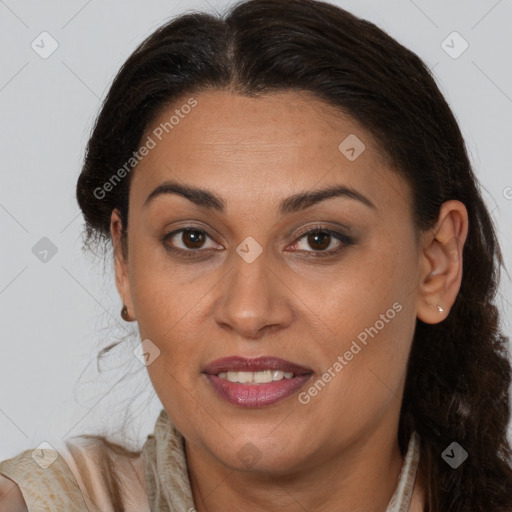 Joyful latino adult female with medium  brown hair and brown eyes