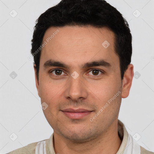 Joyful white young-adult male with short  black hair and brown eyes