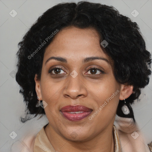 Joyful black adult female with medium  brown hair and brown eyes