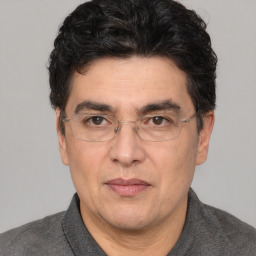 Joyful white adult male with short  black hair and brown eyes