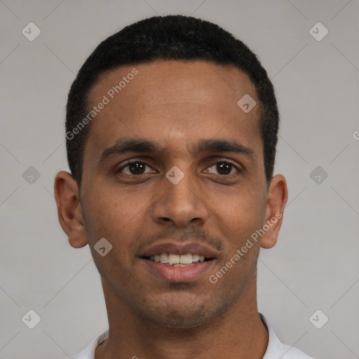 Joyful black young-adult male with short  black hair and brown eyes