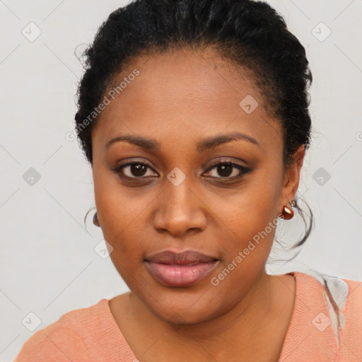 Joyful black young-adult female with short  black hair and brown eyes
