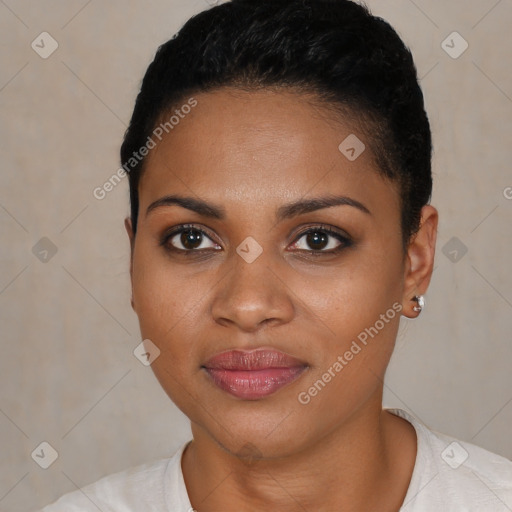 Joyful black young-adult female with short  black hair and brown eyes