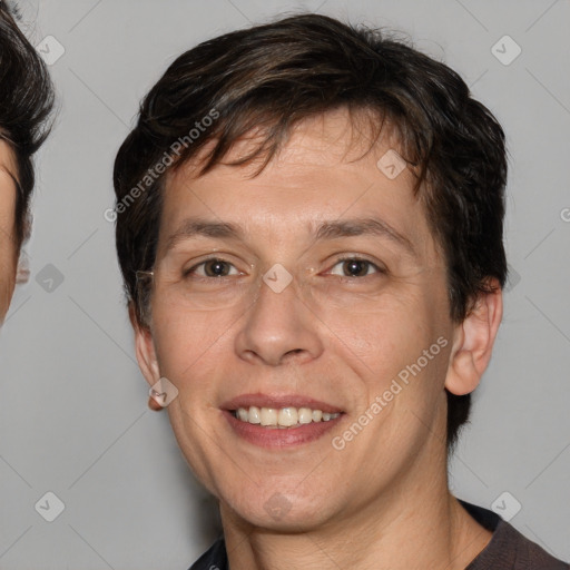 Joyful white adult male with medium  brown hair and brown eyes