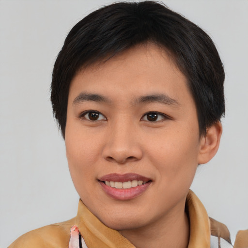 Joyful asian young-adult female with short  brown hair and brown eyes