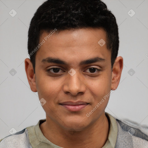 Joyful latino young-adult male with short  brown hair and brown eyes