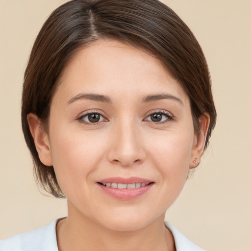 Joyful white young-adult female with medium  brown hair and brown eyes