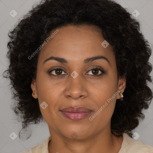 Joyful black adult female with medium  brown hair and brown eyes