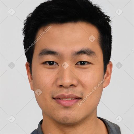 Joyful asian young-adult male with short  black hair and brown eyes