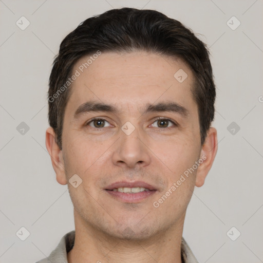 Joyful white adult male with short  brown hair and brown eyes