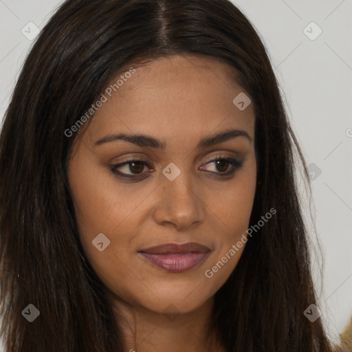 Joyful black young-adult female with long  brown hair and brown eyes