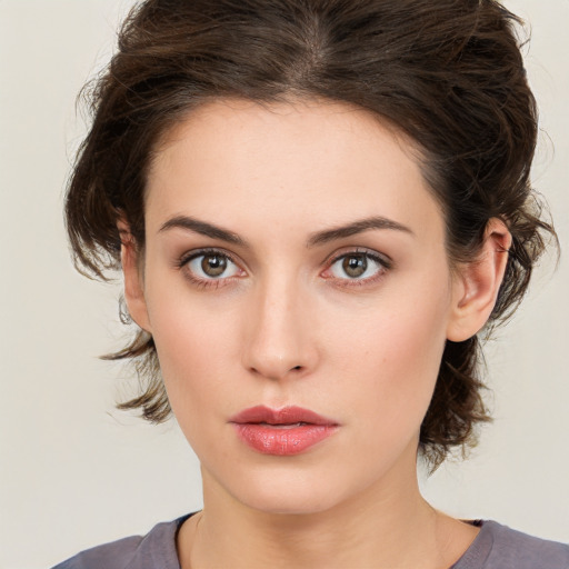 Neutral white young-adult female with medium  brown hair and brown eyes