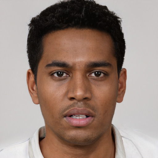 Neutral black young-adult male with short  black hair and brown eyes