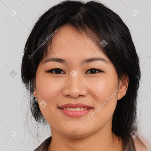 Joyful asian young-adult female with medium  black hair and brown eyes