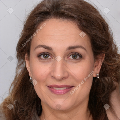 Joyful white adult female with long  brown hair and brown eyes