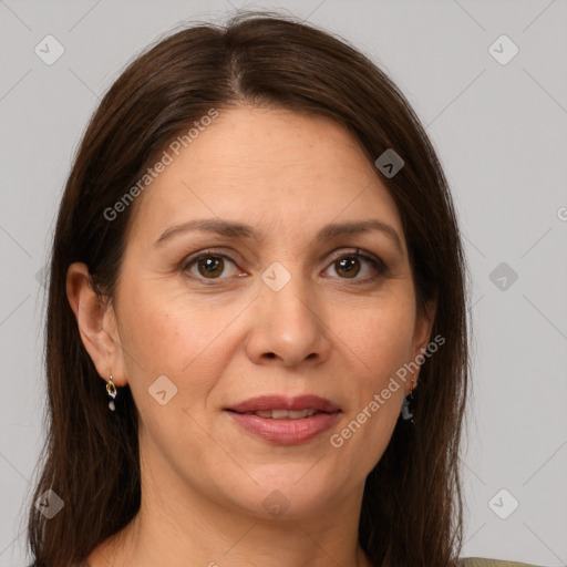 Joyful white adult female with long  brown hair and grey eyes