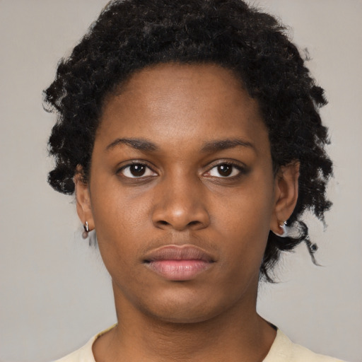 Neutral black young-adult female with short  black hair and brown eyes