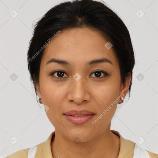 Joyful latino young-adult female with medium  brown hair and brown eyes