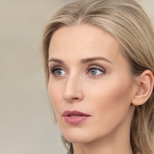 Neutral white young-adult female with long  brown hair and green eyes