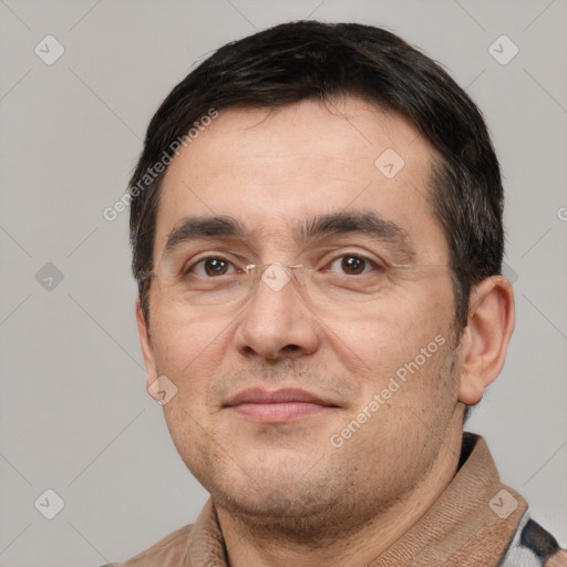 Joyful white adult male with short  black hair and brown eyes