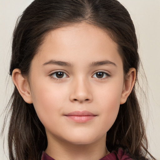 Joyful white child female with long  brown hair and brown eyes