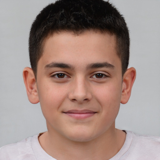 Joyful white child male with short  brown hair and brown eyes