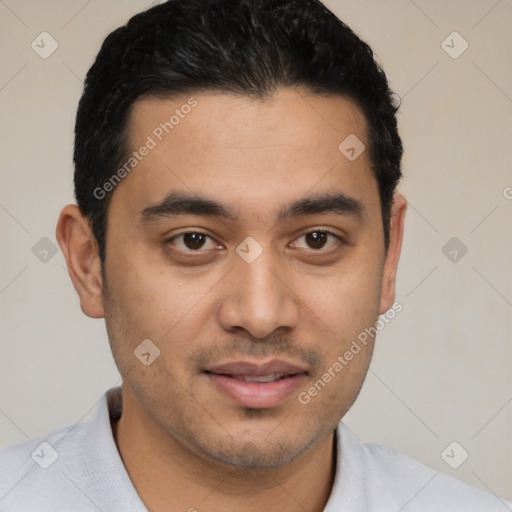 Joyful latino young-adult male with short  black hair and brown eyes