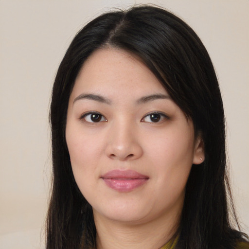 Joyful asian young-adult female with long  black hair and brown eyes