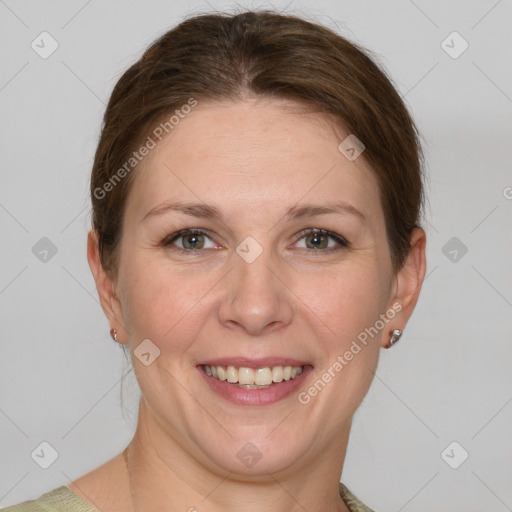 Joyful white adult female with short  brown hair and grey eyes