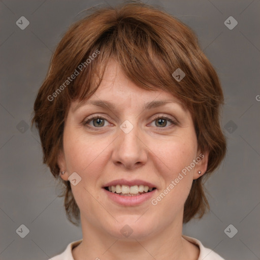 Joyful white adult female with medium  brown hair and blue eyes